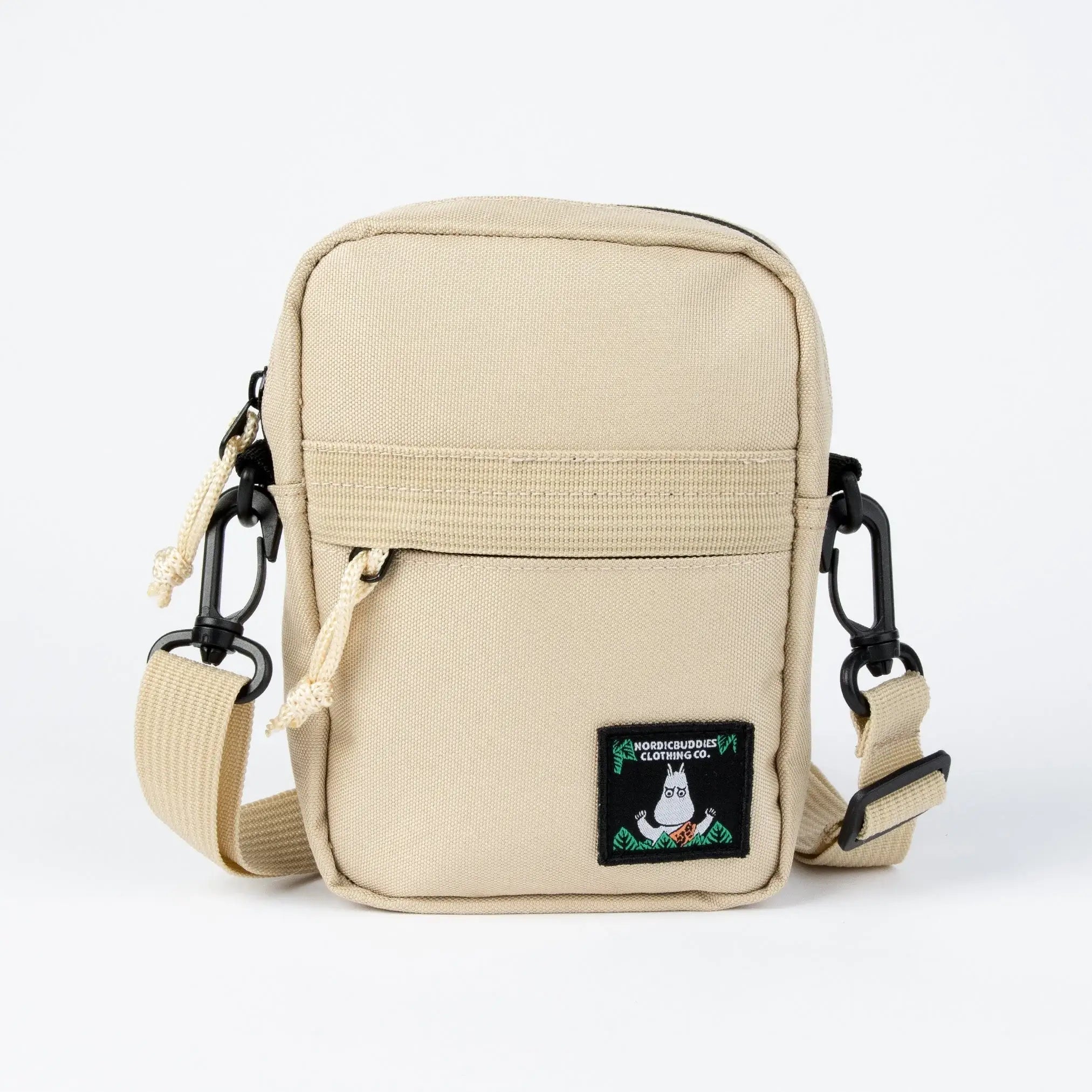 Beigen värinen muumi crossbodu laukku